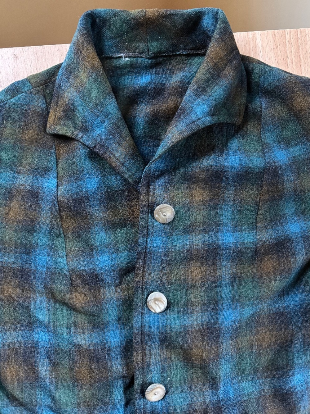 Wool flannel, shell buttons.